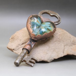 Copper electroformed vintage skeleton key with handmade heart-shaped borosilicate glass cab.